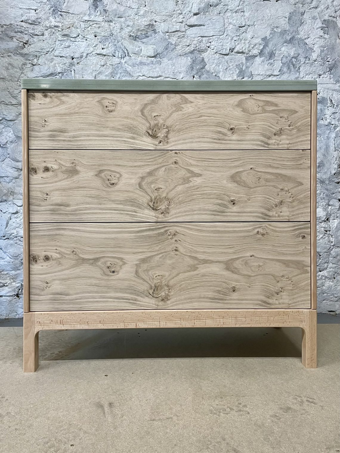 Chest of drawers made with matched character oak veneer fronts.