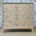 Chest of drawers made with matched character oak veneer fronts.