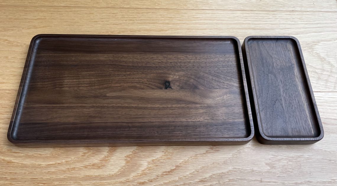 Two trays made from solid walnut.