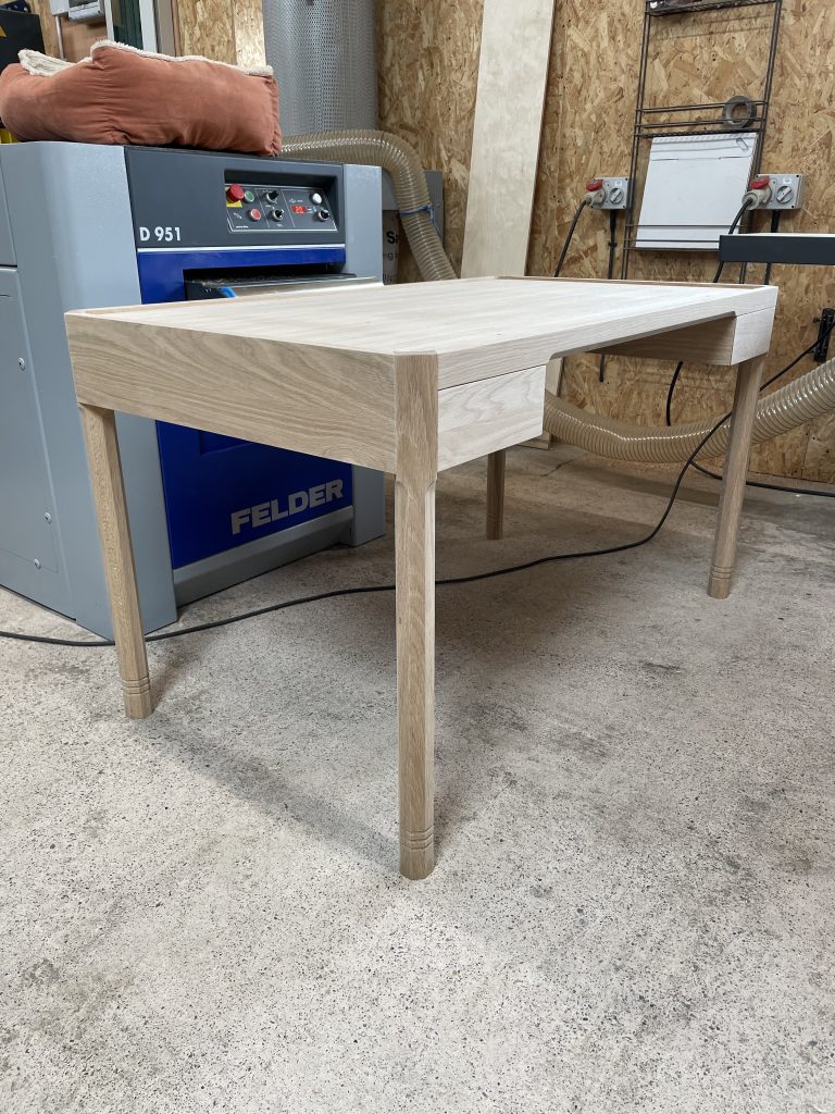 Wider view of desk.
