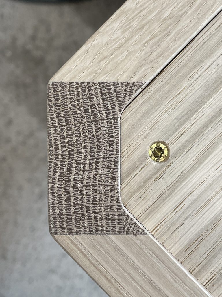 Corner from above with screw.