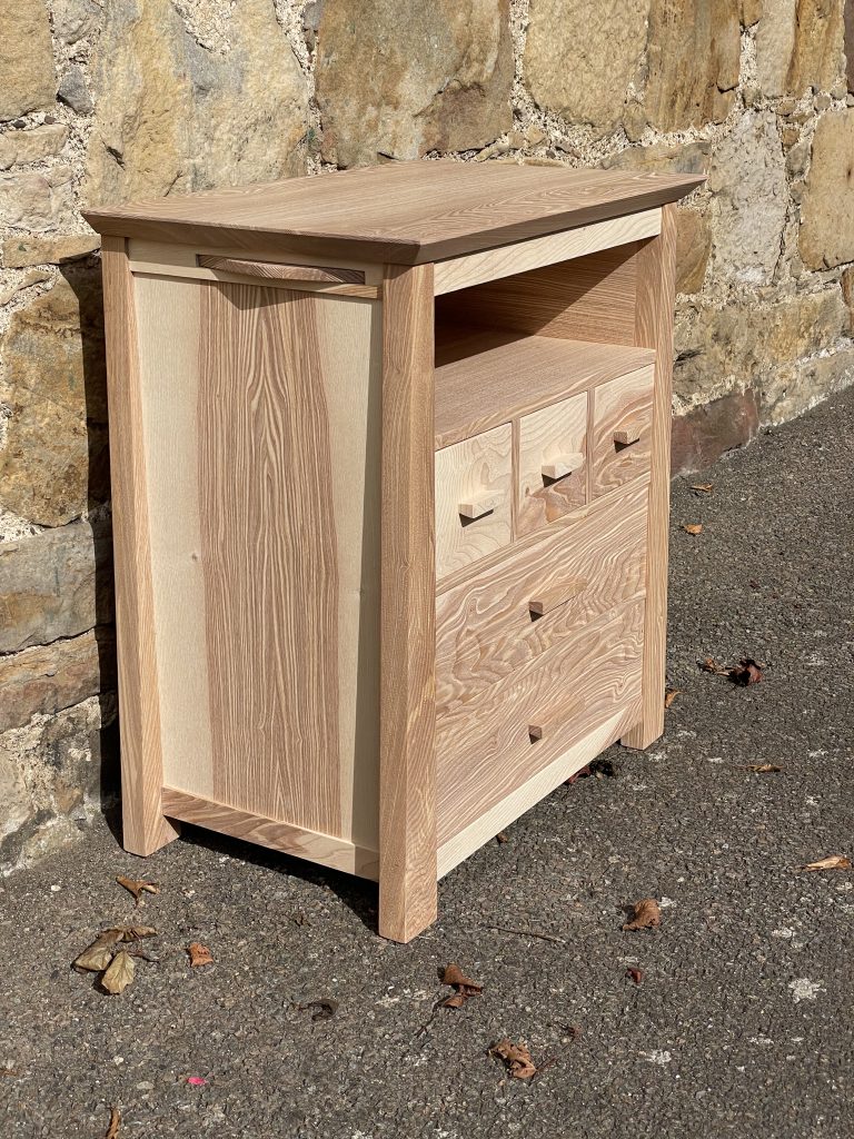 "Chaffinch" bedside cabinet made by Iain Stirling of Chapelhill Fine Furniture. View from front left.