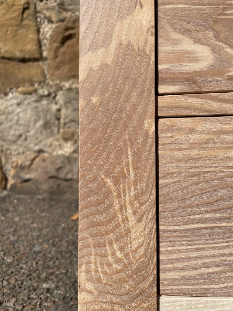 "Chaffinch" bedside cabinet made by Iain Stirling of Chapelhill Fine Furniture. Close-up of flaming pattern in ash grain.