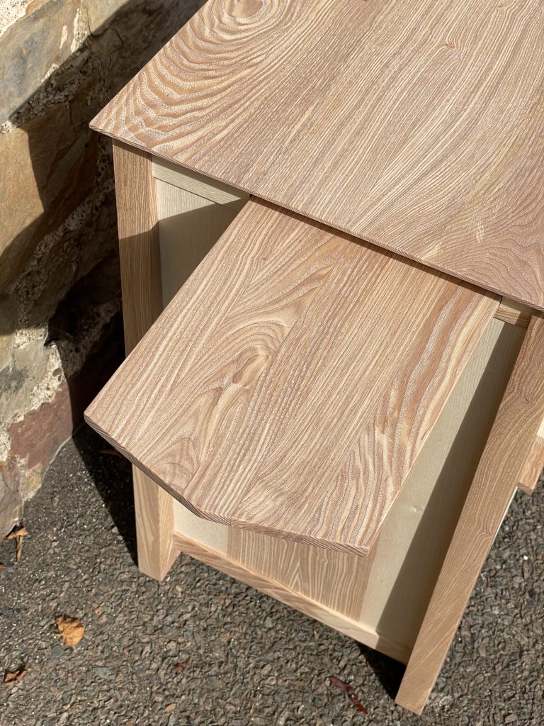 "Chaffinch" bedside cabinet made by Iain Stirling of Chapelhill Fine Furniture. View of extended tray from left.