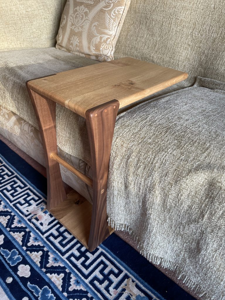 Eider sofa table in oak and walnut by Chapelhill Fine Furniture with a sofa.