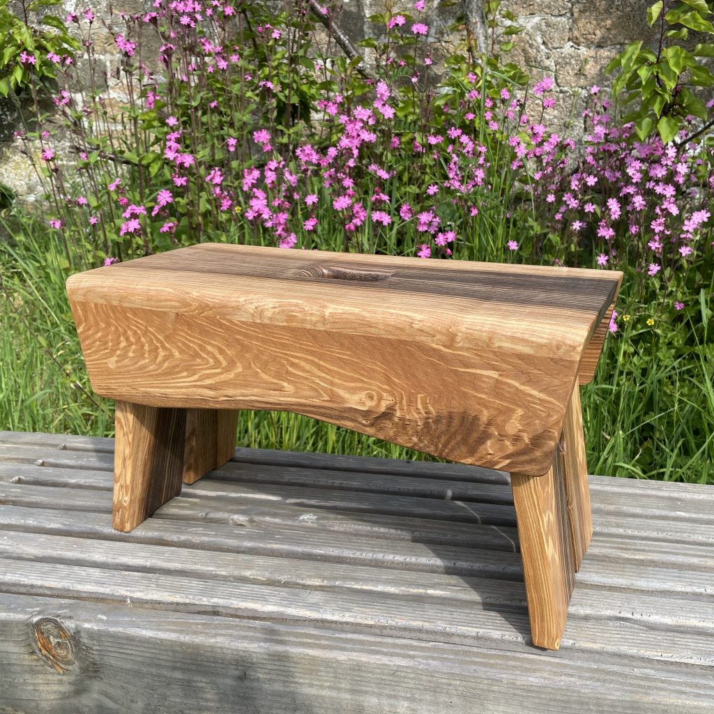 Scottish creepie stool in spalted olive ash, made by Chapelhill Fine Furniture.