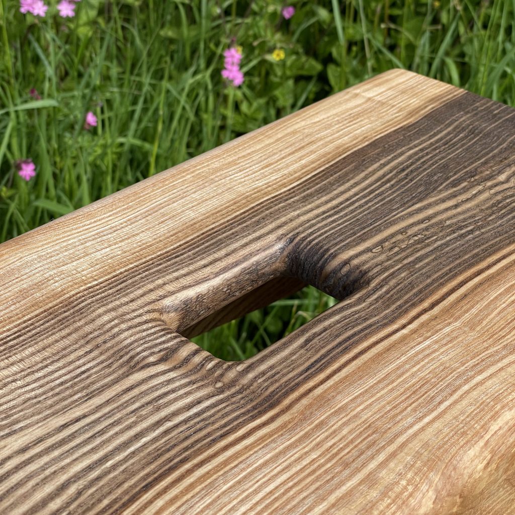 Scottish creepie stool in spalted olive ash, made by Chapelhill Fine Furniture.