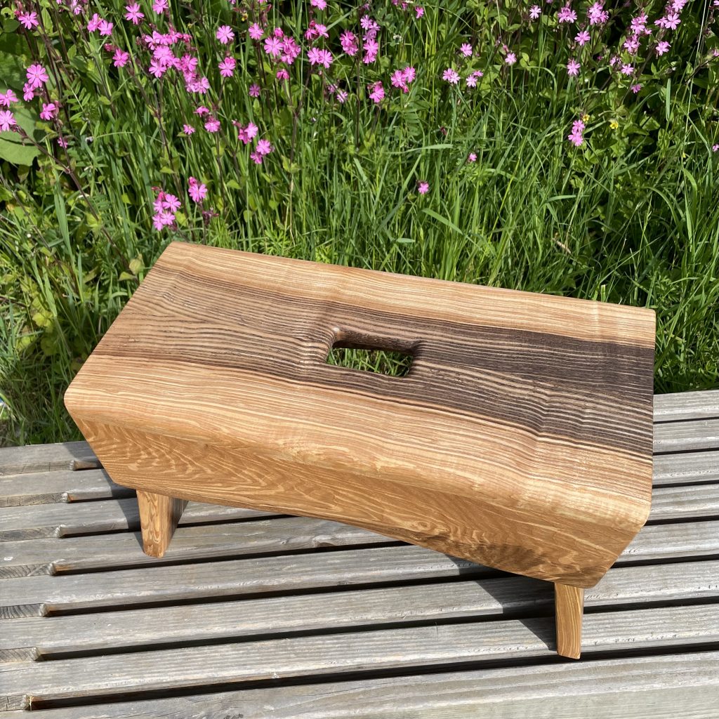 Scottish creepie stool in spalted olive ash, made by Chapelhill Fine Furniture.