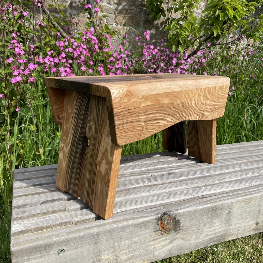 Scottish creepie stool in spalted olive ash, made by Chapelhill Fine Furniture.
