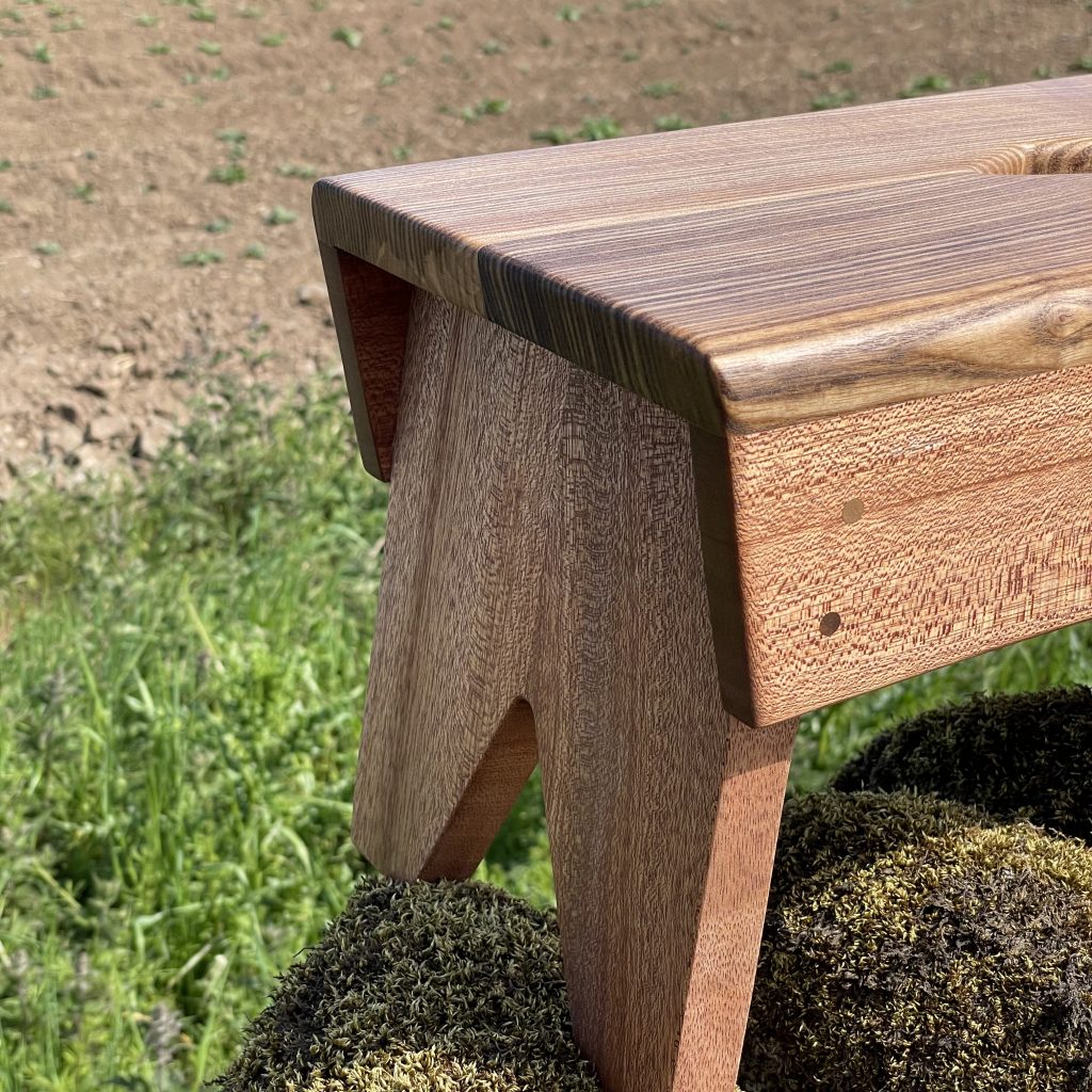 Scottish creepie stool in olive ash and sapele, made by Iain Stirling of Chapelhill Fine Furniture.