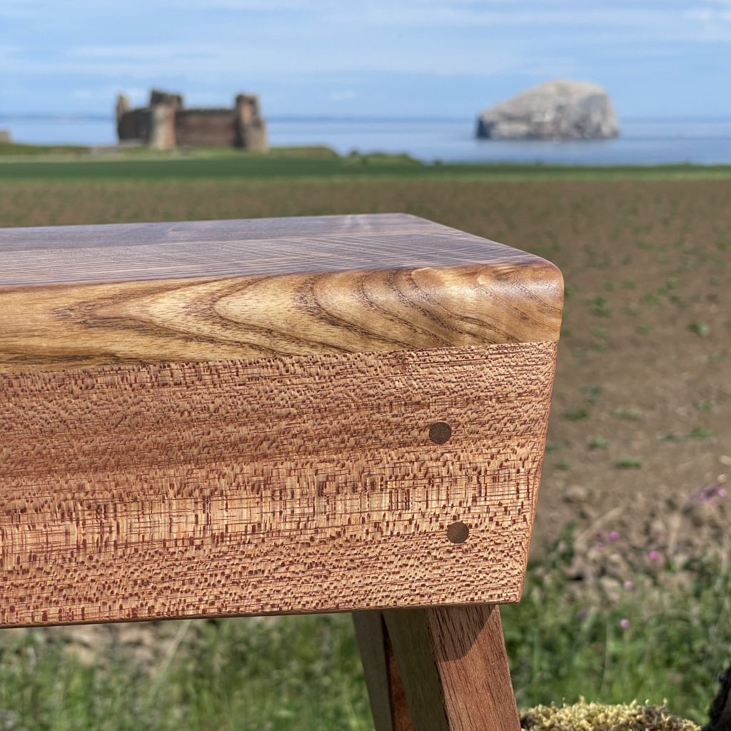 Scottish creepie stool in olive ash and sapele, made by Iain Stirling of Chapelhill Fine Furniture.