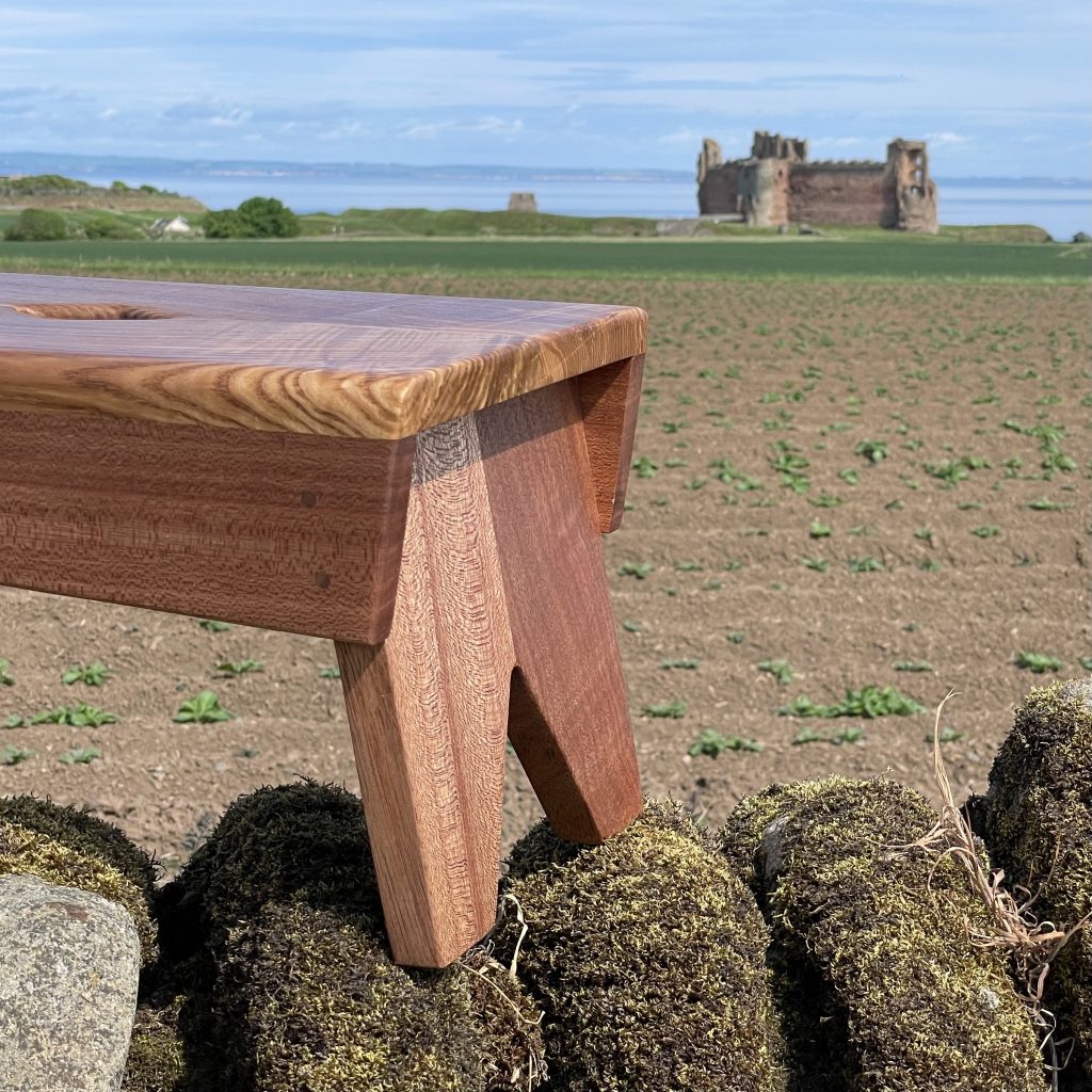Scottish creepie stool in olive ash and sapele, made by Iain Stirling of Chapelhill Fine Furniture.